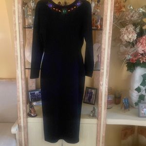 Andrea Jovine black jeweled backless long sleeved sweater dress.